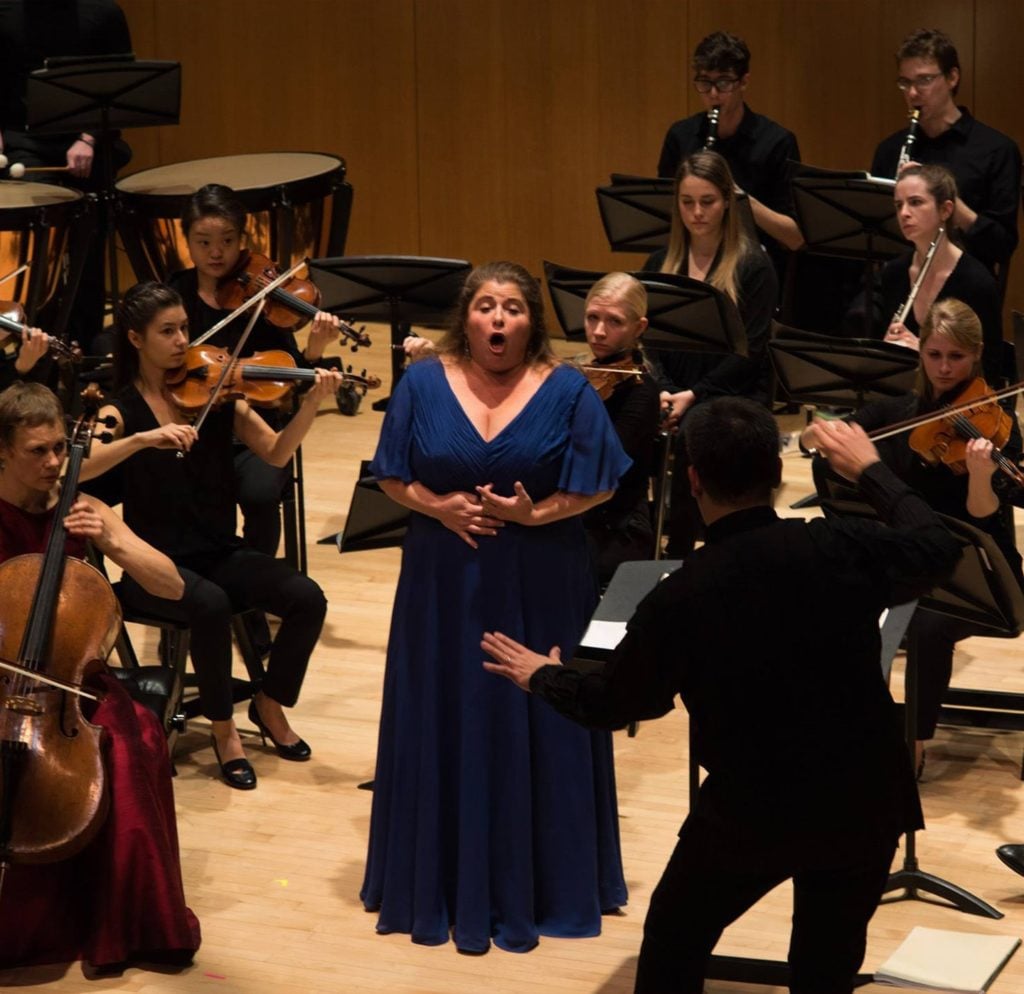 allison charney performs in the center of orchestra